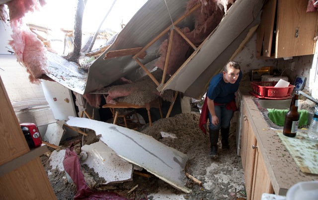 Tabitha Welch helps a friend search her home for valuables 