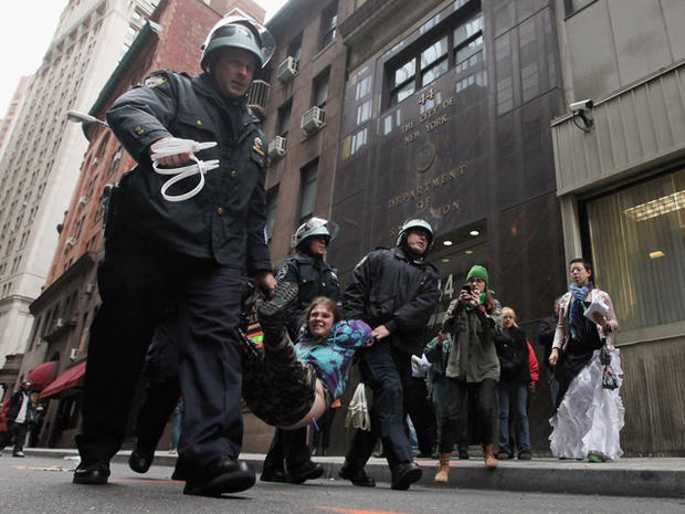 A protester affiliated with Occupy Wall Street is arrested by police a few blocks from the New York Stock Exchange Nov. 17, 2011, in New York City. 