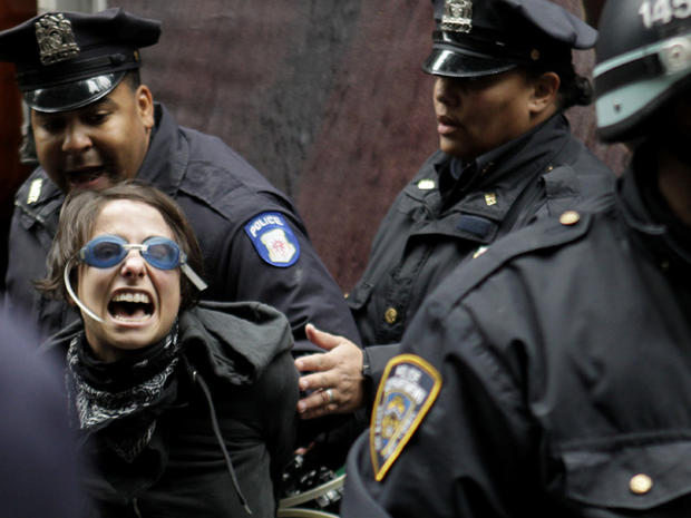An Occupy Wall Street protester yells as she is arrested by police in New York Nov. 17, 2011. 