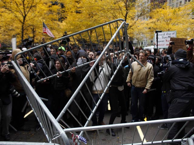 Occupy Wall Street protesters remove police barricades in Zuccotti Park Nov. 17, 2011, in New York City. Hundreds of protesters attempted to shut down the New York Stock Exchange, blocking roads and tying up traffic in lower Manhattan. 