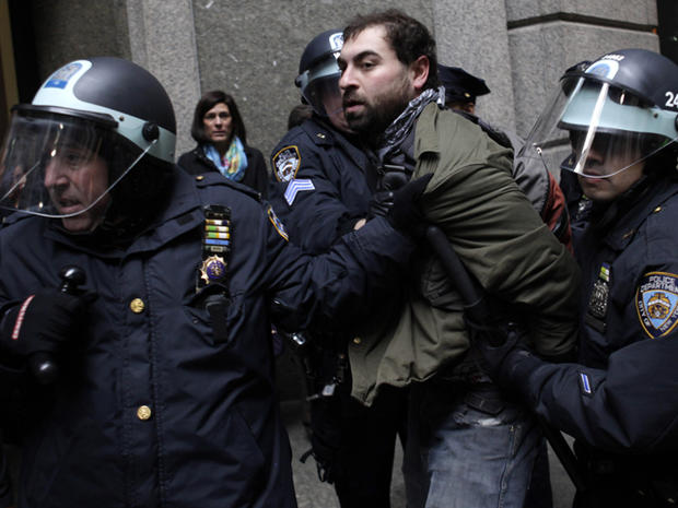 An Occupy Wall Street protester is arrested after trying to block the entrance of an office building near the New York Stock Exchange in New York Nov. 17, 2011. 