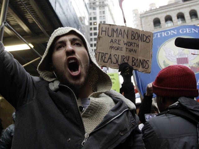 Demonstrators affiliated with the Occupy Wall Street movement march through the streets of New York's financial district Nov. 17, 2011. 