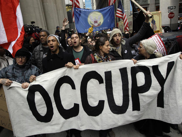 Demonstrators affiliated with the Occupy Wall Street movement march through the streets of New York's financial district Nov. 17, 2011. 
