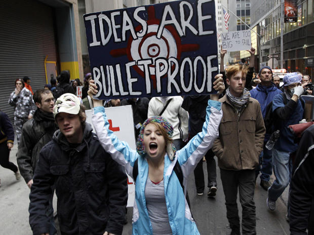 Demonstrators affiliated with the Occupy Wall Street movement march through the streets of New York's financial district Nov. 17, 2011. 