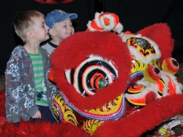 1/21/12- Family &amp; Pets- Guide to Chinese New Year – Kids with friendly red dragon 