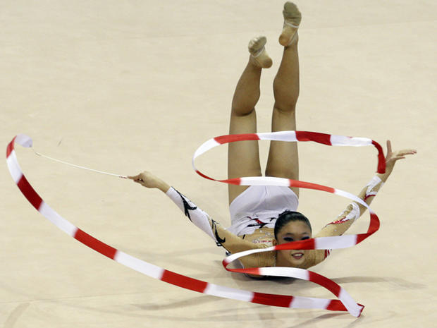 Ann Kwee Peng performs with a ribbon in rhythmic gymnastics 