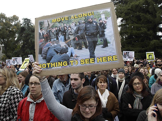 Student Sheena Campbell holds a sign during a rally on the University of California, Davis campus in Davis, Calif., Nov. 21, 2011 after police pepper-sprayed peaceful demonstrators during a protest at the same spot on Friday.  