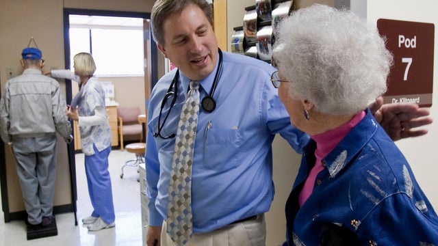 Doctor Don Klitgaard greets patient 