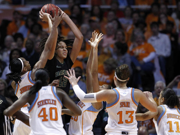 Brittney Griner  is surrounded by Tennessee players 