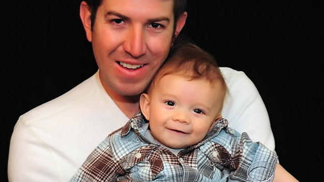 Ryan Kules poses for a picture with one of his children in an undated family photo.  