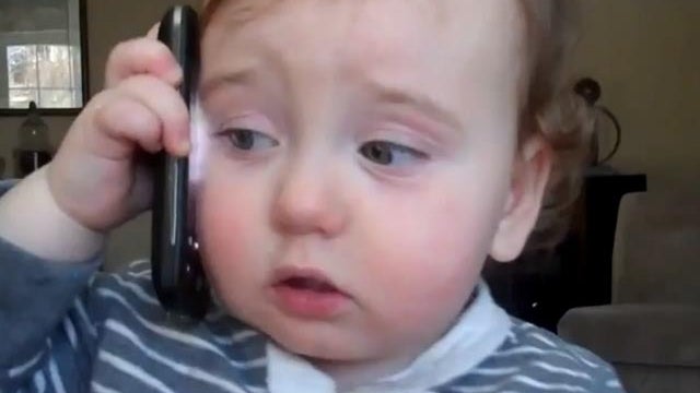 business baby on the phone 
