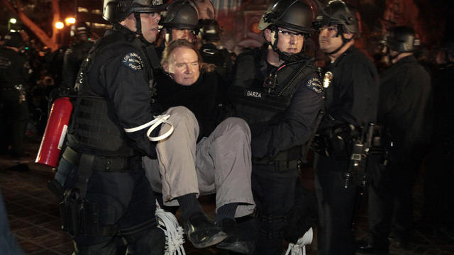 A protester is arrested as Los Angeles police officers evict protesters from the Occupy Los Angeles camp 