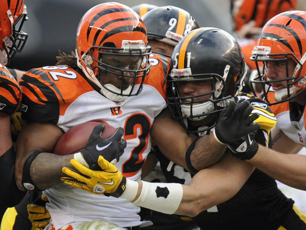 Cedric Benson is stopped by James Farrior  