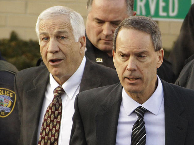 Former Penn State University assistant football coach Jerry Sandusky, left, walks with his attorney Joe Amendola, right, as he leaves the Centre County Courthouse after waiving a preliminary hearing Tuesday, Dec. 13, 2011 in Bellefonte, Pa. 
