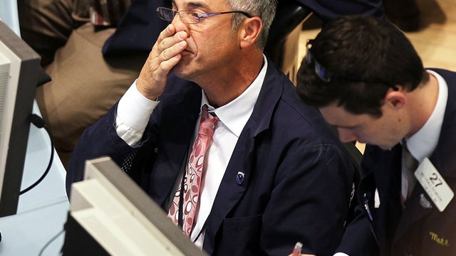 Traders work on the floor of the New York Stock Exchange Dec. 12, 2011, in New York City following fresh investor doubts about Europe's debt crisis. 