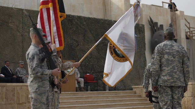 Sec. of Defense Leon Panetta, left, during the encasing of the U.S. Forces-Iraq colors 