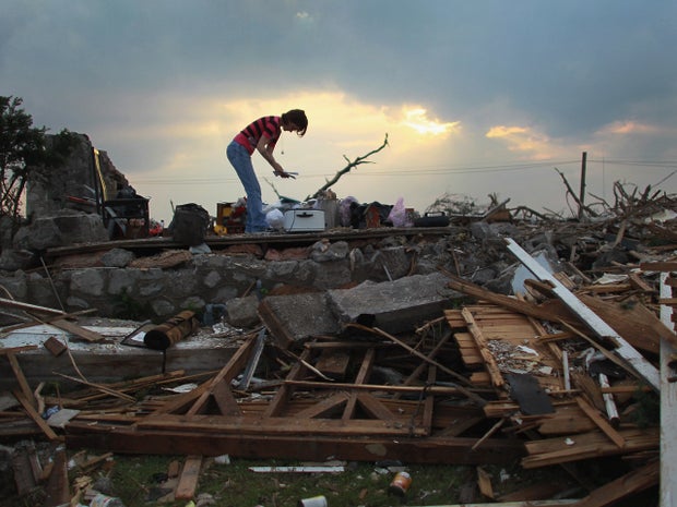 Shanie Spencer salvages what she can from what remains of her house 