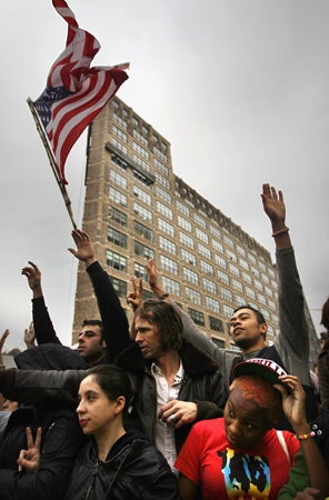 Occupy Wall Street activists protest near Duarte Square after police removed the protesters  