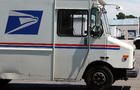 U.S. Postal Service trucks are seen parked near the loading dock at the U.S. Post Office sort center Aug. 12, 2011, in San Francisco. 