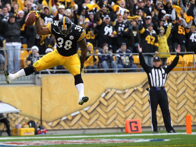 John Clay celebrates after scoring a touchdown 