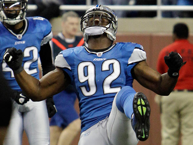 Cliff Avril reacts after scoring a touchdown on an interception 