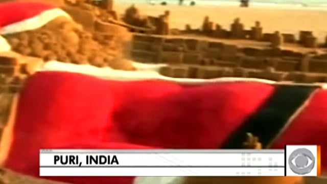 35-foot high sand Santa on beach in eastern India 12/24/11. It was created by team led by Internationally acclaimed sand artist Sudarsan Patnaik. 