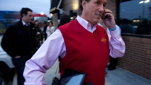 Former Pennsylvania Sen. Rick Santorum talks on the phone after a campaign stop Dec. 30, 2011, in Ames, Iowa. 