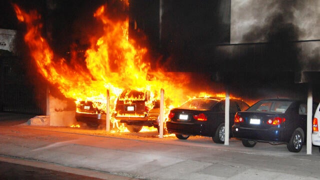Burning cars at site of arson fire in Hollywood section of Los Angeles Friday 
