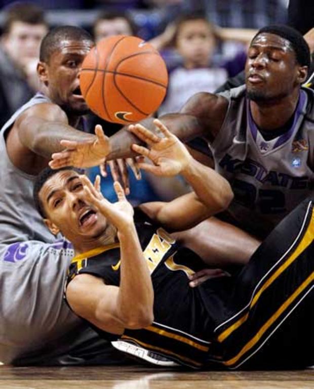Phil Pressey passes the ball away under pressure  