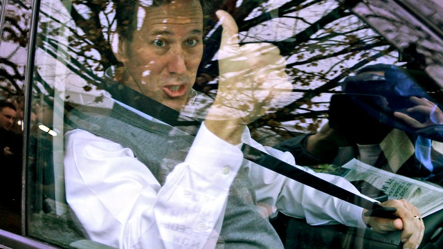 Former Pennsylvania Sen. Rick Santorum gives a thumbs up after after campaigning at the Keene Public Library in Keene, N.H., Jan. 6, 2012. 