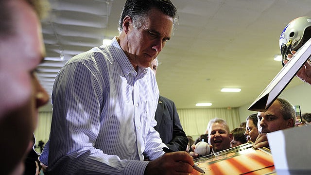 Republican presidential hopeful Mitt Romney greets supporters after addressing a rally at McKelvie Intermediate School in Bedford, New Hampshire, January 9, 2012.  