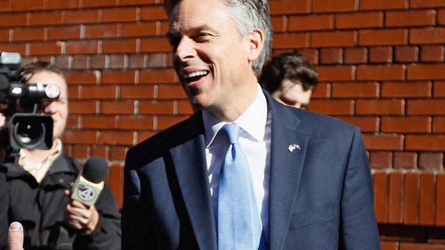 Jon Huntsman speaks with the media as he arrives for a Huckabee forum 