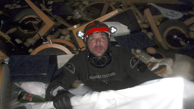 Italian Coast Guard diver searches Costa Concordia for survivors 