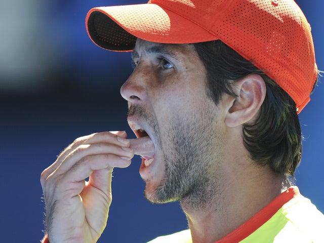 Fernando Verdasco pulls on his tongue in frustration 