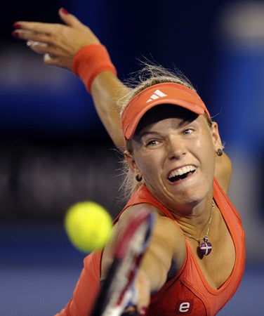 Caroline Wozniacki reaches out for a return 