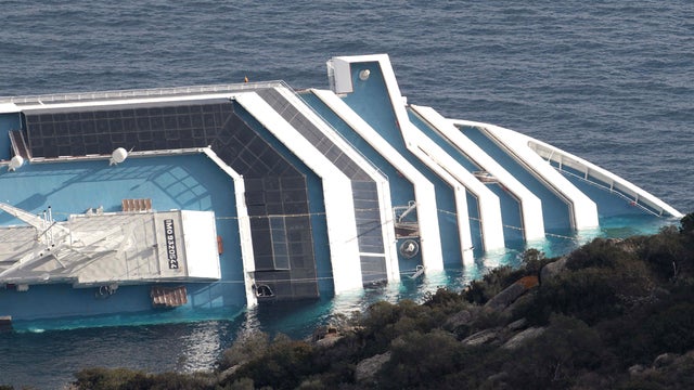 Costa Concordia lays on its side off the tiny Tuscan island of Giglio 