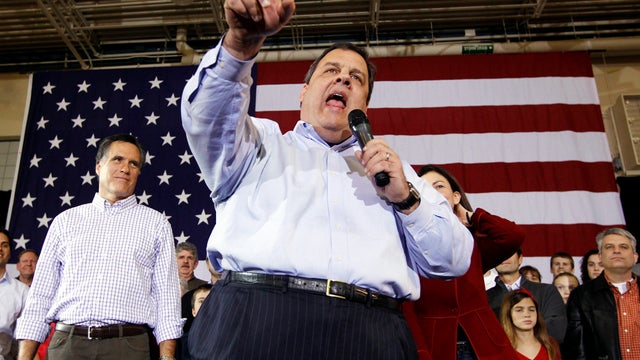 New Jersey Gov. Chris Christie, center, campaigns with former Massachusetts Gov. Mitt Romney at Exeter High School in Exeter, N.H., Jan. 8, 2012. 