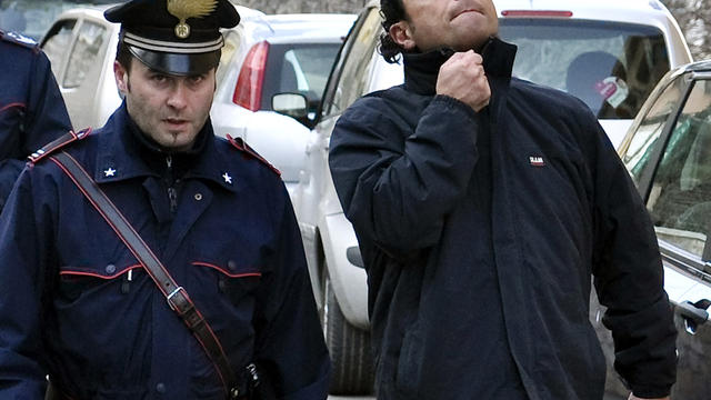 Francesco Schettino, right, the captain of the luxury cruiser Costa Concordia, which ran aground off Italy's tiny Tuscan island of Isola del Giglio, is taken into custody by Carabinieri in Porto Santo Stefano, Italy, Jan. 14, 2012. Seamen have expressed a 