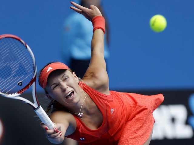 Caroline Wozniacki reaches for a forehand return 
