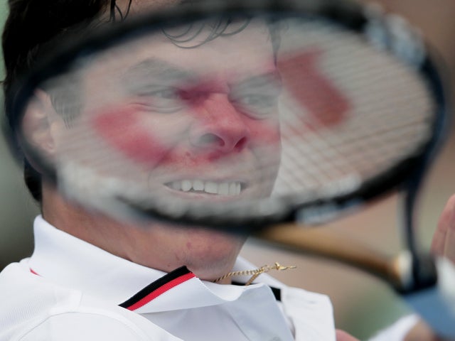 Milos Raonic makes a forehand return 