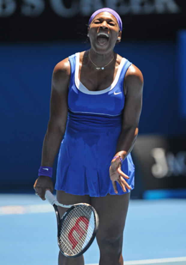 Serena Williams  yells in frustration 