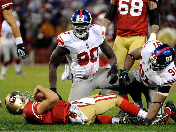 Jason Pierre-Paul and Justin Tuck react after they sacked Alex Smith 