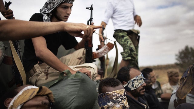 Body of Libyan dictator Muammar Qaddafi lies on mattress in morgue in Misrata, Libya on Oct. 21, 2011  