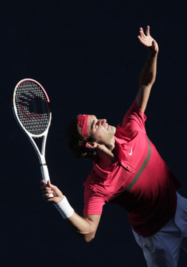 Roger Federer serves to Argentina's Juan Martin Del Potro 