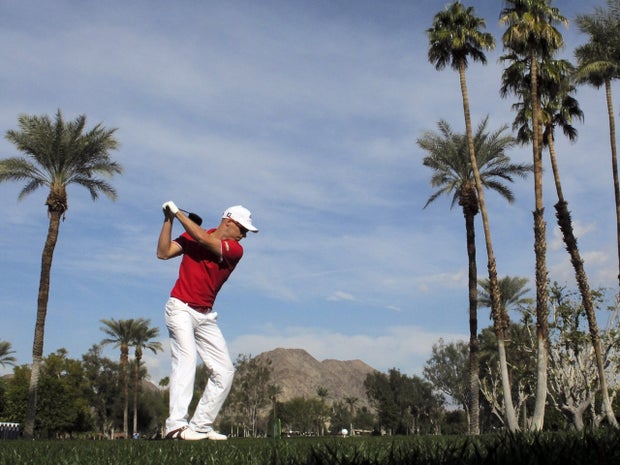 Ben Crane hits his tee shot on the fifth hole 