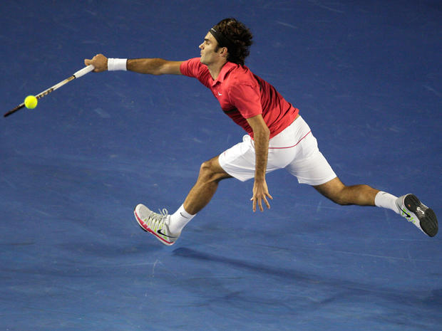 Roger Federer reaches for a return shot  