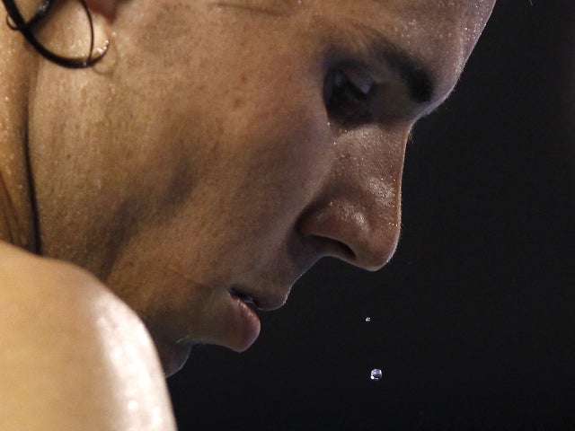 Beads of sweat drop off the face of Spain's Rafael Nadal 