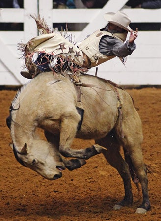 Chris Harris competes during the bareback bronc competition 