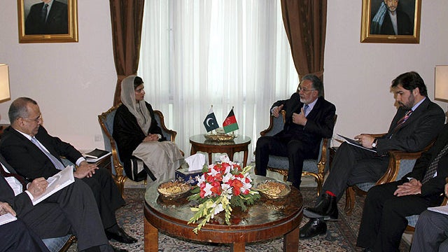 Pakistan's Foreign Minister Hina Rabbani Khar, center left, talks with Afghan counterpart Zalmai Rasool during their meeting in Kabul, Afghanistan, Feb. 1, 2012.  