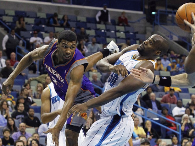 Ronnie Price gets tangled up with Emeka Okafor 